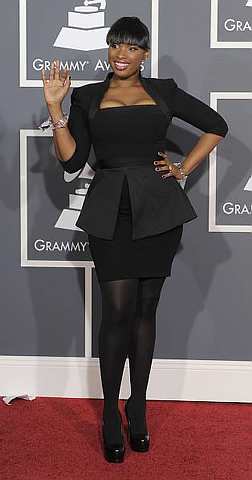 Jennifer Hudson paired her futuristic Victoria Beckham Collection ensemble with black tights, lucite bangles, and extra-high platform stilettos. 