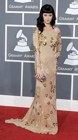 Katy Perry in a nude, floor-skimming, flower-embellished Zac Posen dress.