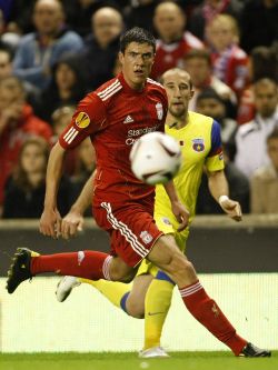 Liverpool's big, versatile and very highly-rated young defender Martin Kelly can play across the back four.