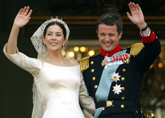 Crown prince Frederik and Crown princess Mary of Denmark wave to wellwishers from the balcony at Amalienborg castle in Copenhagen, in May 2004 after their wedding ceremony