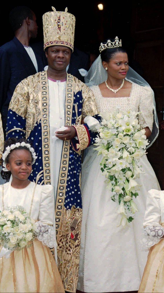 The king of Uganda's Buganda tribe, one of Africa's most glorious and powerful 19th century kingdoms, Kabaka Ronald Muwenda Mutebi II, and his new wife Queen Sylvier Nagginda step out of church after their wedding  at an Anglican cathedral near Kampala, Uganda, Friday, August 27, 1999