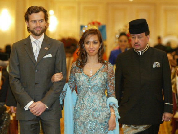 Daughter of Sultan of Selangor Sultan Sharafuddin Idris Shah, Tengku Zatashah Idris (centre) and Aubry Rahim Mennesson (left), at their wedding reception.