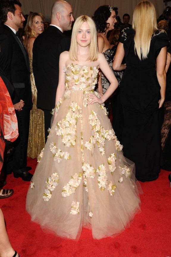 Dakota Fanning wore a floral applique strapless gown from the Valentino Resort 2011 collection.