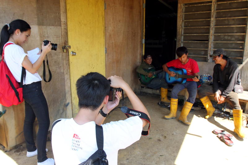 The Indonesian workers at Vincent chang's plantation live and work together, spending most of their free time resting, watching TV or singing and playing the guitar.