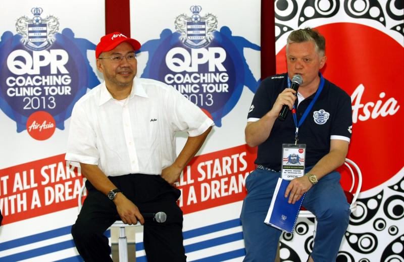 AirAsia Berhad Executive Chairman Dato' Kamarudin Meranun (left) and QPR Trust CEO Andy Evans at the official launch of AirAsia - Queens Park Rangers Football Coaching Clinic in SMK Seksyen 11, Shah Alam. 
