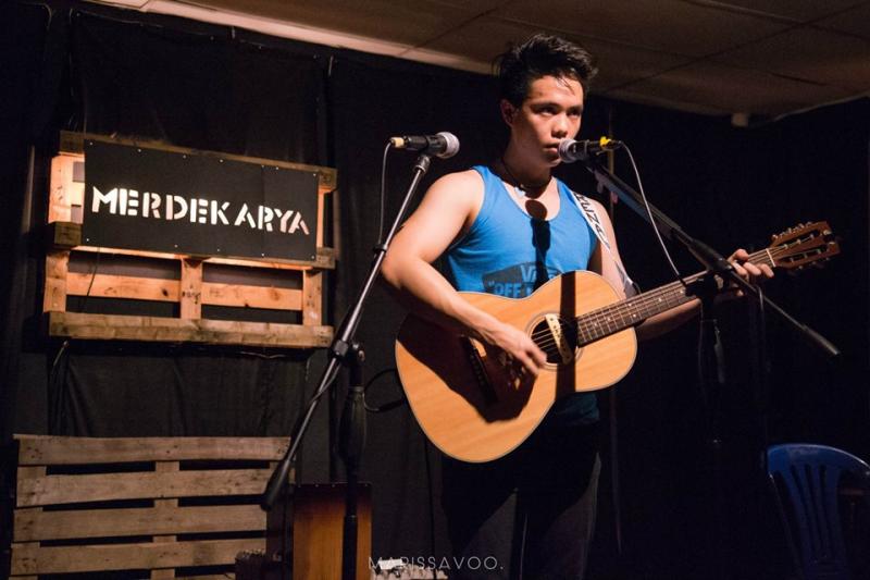 Singer-songwriter Christian Palencia, the 'barefoot musician', performing at Merdekarya.
