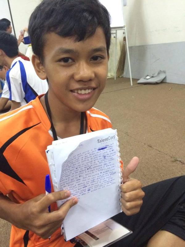 The Inspire Southeast Asia camp gave English lessons to participants like Muhammad Aqil, 14, pictured here writing during the 'Dear Diary' session.