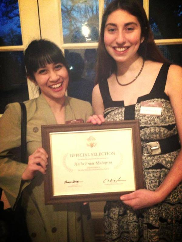 Aiman and her friend, Kira are all smiles as they proudly hold their certificate of Official Selection at the White House.