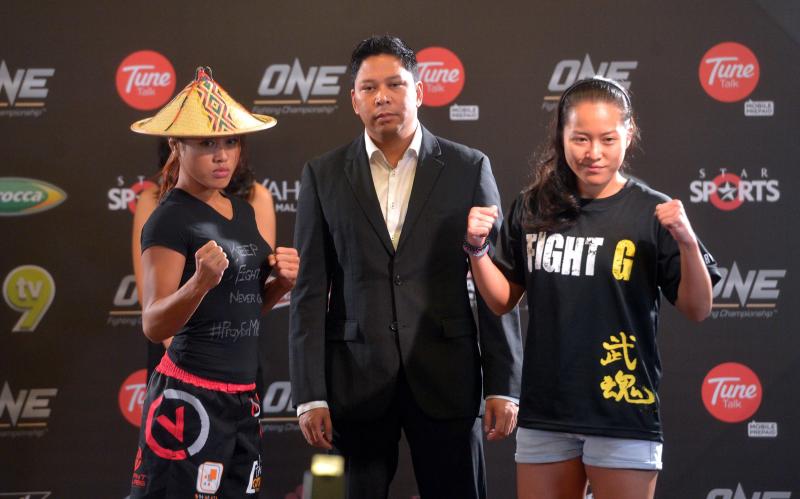 The Dusun-Malay fighter (left) at the weigh-in for her highly-anticipated rematch with Singapore's Sherlyn Lim (right).