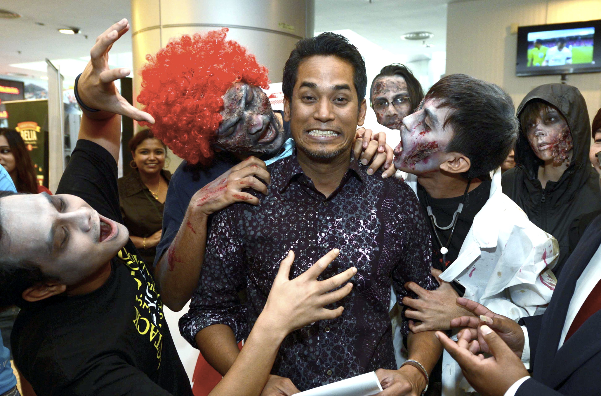 Youth And Sports Minister, Khairy Jamaluddin gets a firsthand experience of the undead at the Festival Belia Putrajaya 2014 launch.