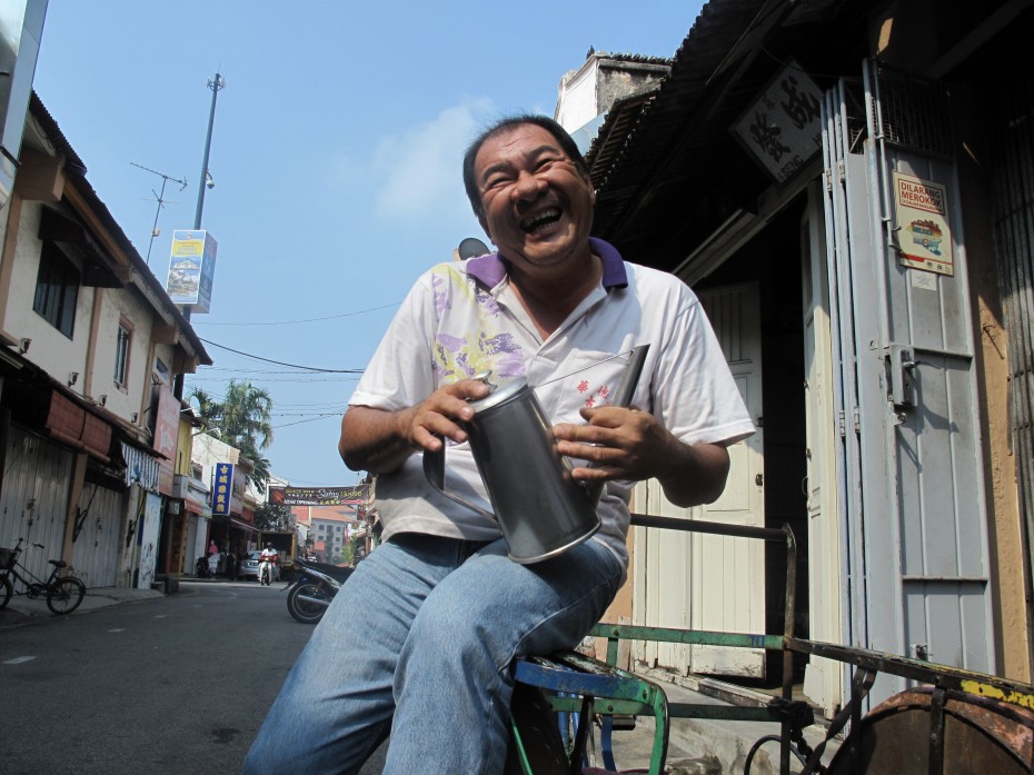 Happy camper: Tinsmith Lee Kiang Sim picked up the family trade almost 40 years ago, and he is one of the few remaining tinsmiths in the Jonker Street area.