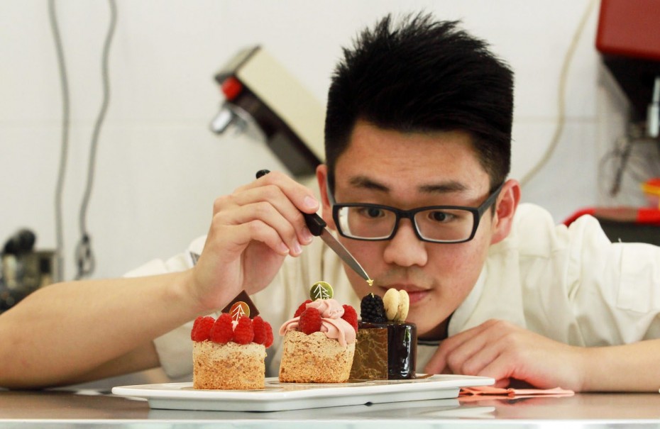 Lim putting a gold leaf on his Mousse au Chocolat – a chocolate sponge cake with dark chocolate mousse, hazelnut crunch and a mirror glaze.