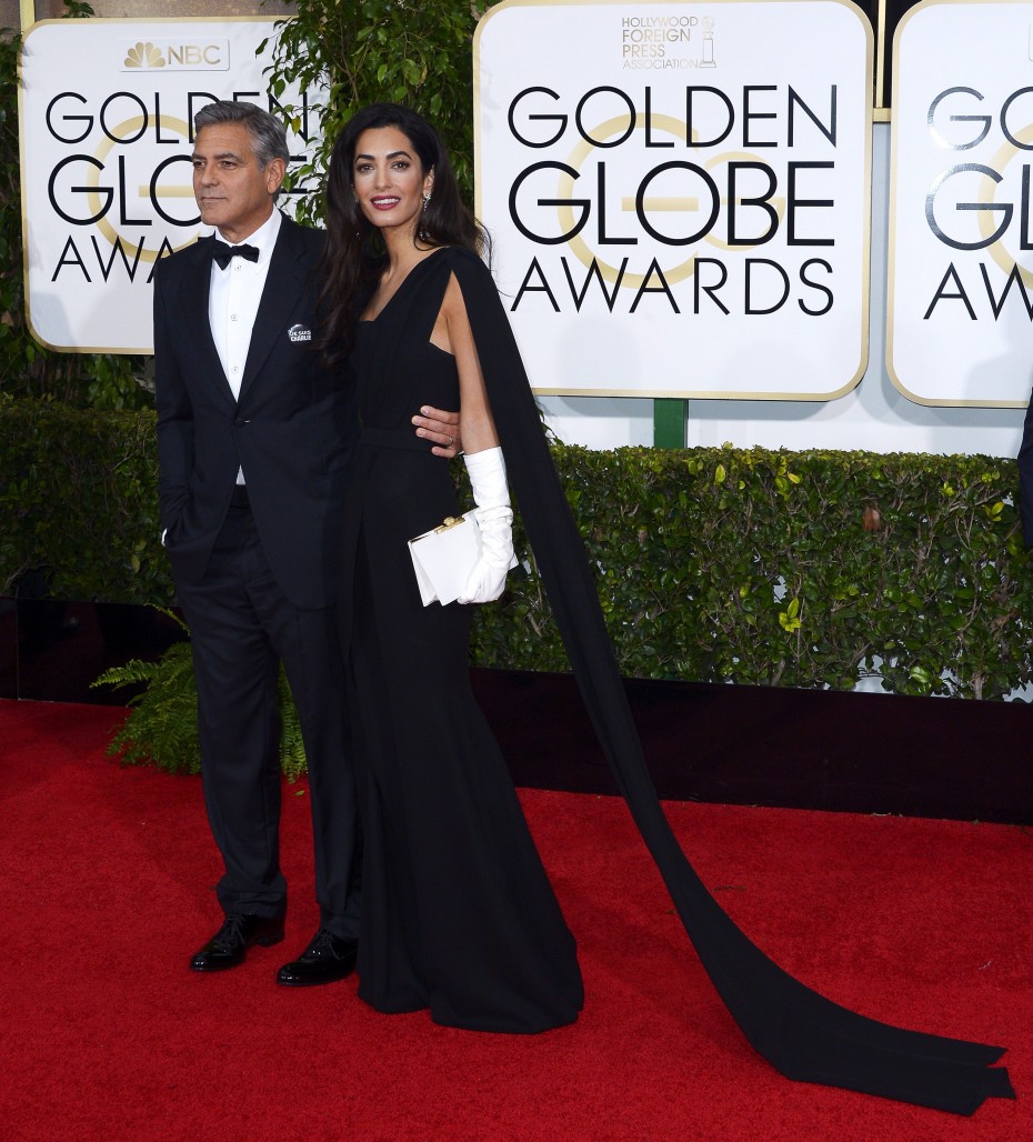 George Clooney poses with wife Amal on the red carpet at the 72nd Annual Golden Globe Awards, where he was awarded the -- Photo by EPA.