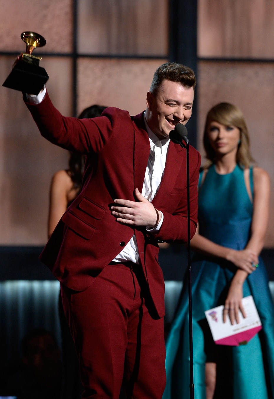 Sam Smith accepts the Best New Artist award from his friend, Taylor Swift. - Photo by AFP