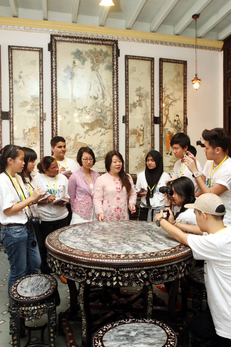 The participants from BRATs Malacca workshop interviewed Baba & Nyonya Heritage Museum curator, Melissa Chan and lead tour guide, Christina Ong. The house, having been in Chan's family for five generations, was turned into a museum in 1985 and it showcases an array of furniture and traditional costumes to provide insight into the lifestyle of wealthy Peranakan families in the past. SAMUEL ONG / THE STAR, 18TH SEPTEMBER 2014.