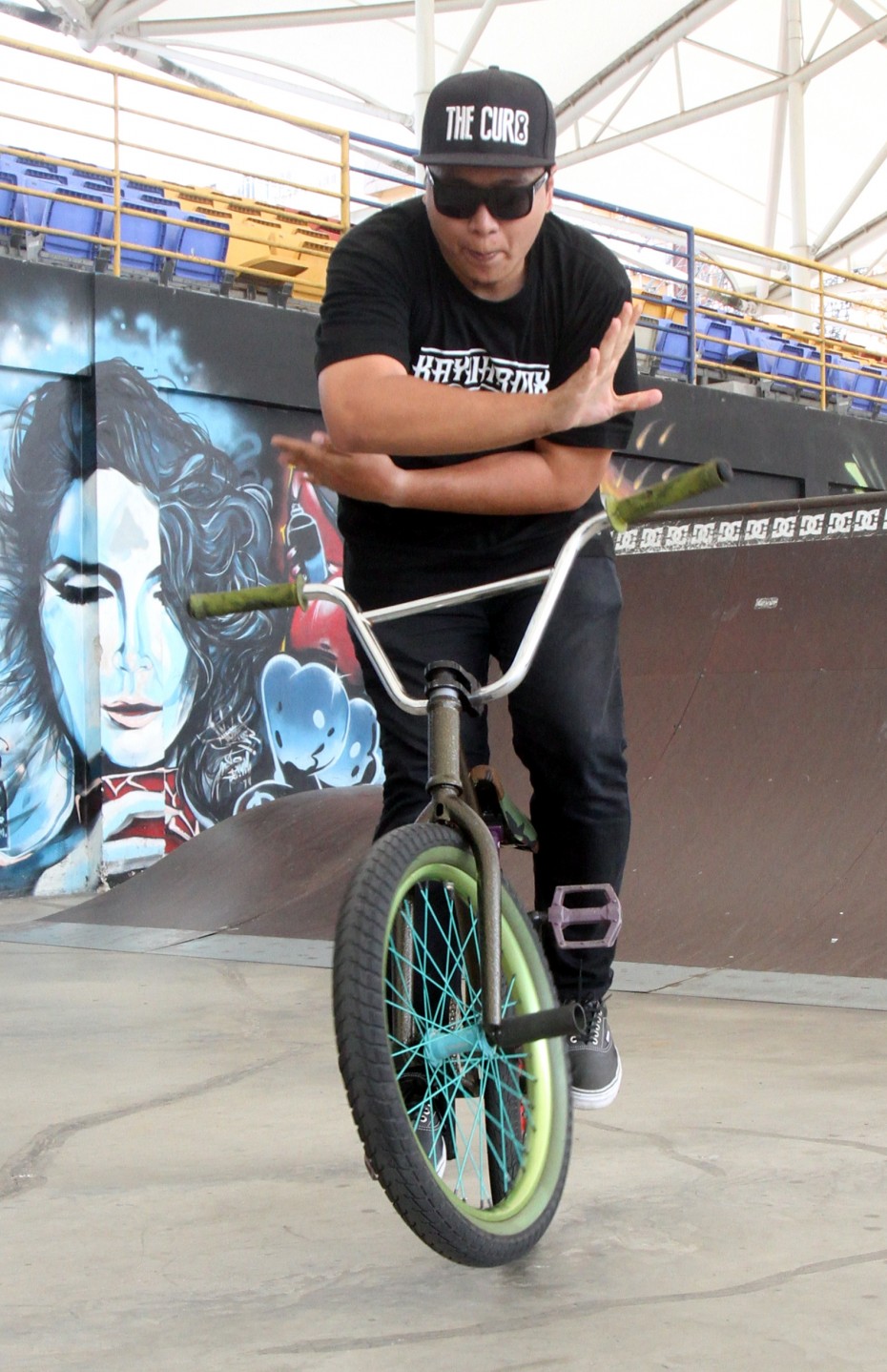 Shahrul Reezwan started BMX riding at the age of 16. Now, the 29-year-old has his own bicycle shop. "When I started, there wasn't any shop in Malaysia selling BMX equipment and bicycle parts. So I took the initiative to start one on my own and riders can easily purchase them instead of ordering online," said Shahrul. Here, he is doing a bar spin on his bicycle.  M. Azhar Arif/The Star 09 Apr 2015