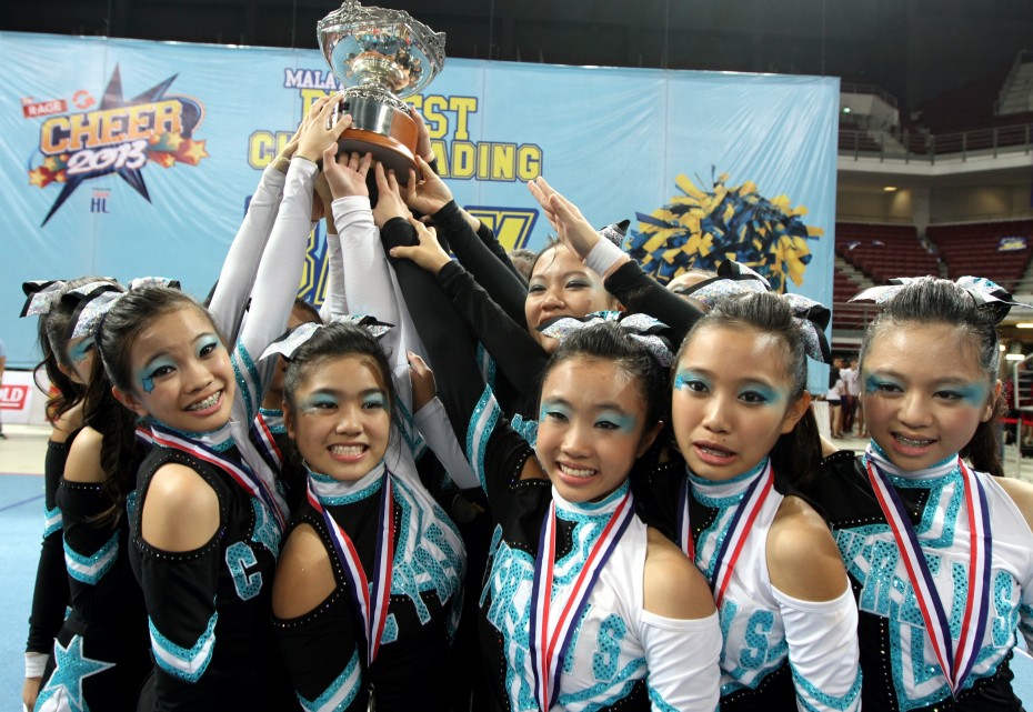 The Cyrens holding up the Cheer 2013 champions' trophy. Who's taking it home this year? Photo: LOW LAY PHON/The Star