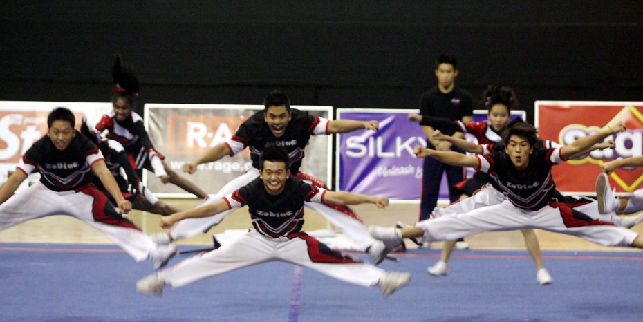 Doing the splits with splitting wide grins – only at CHEER 2012.