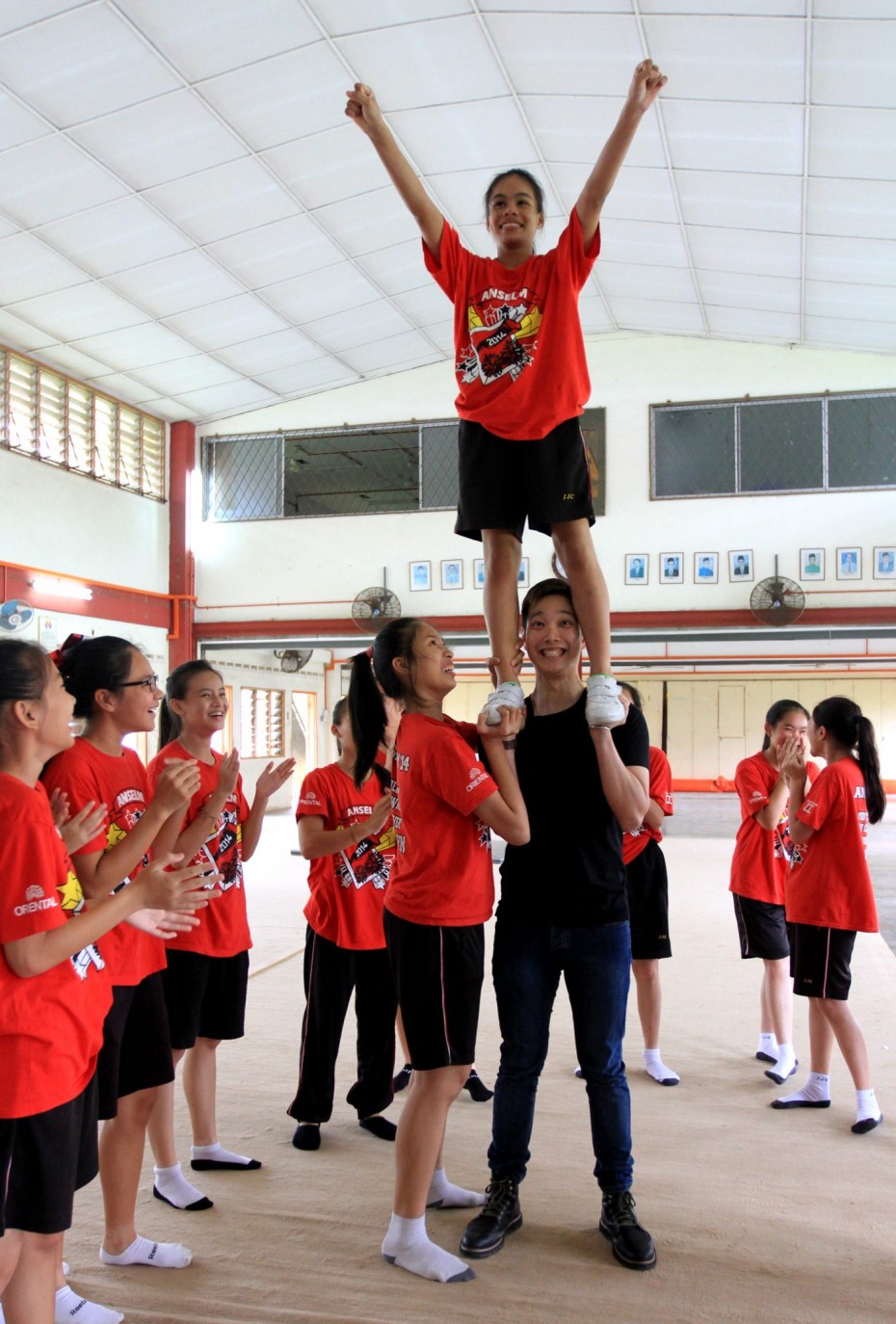 Teo also impressed the cheerleaders by lifting one of them! - Photo: Sam Tham/The Star