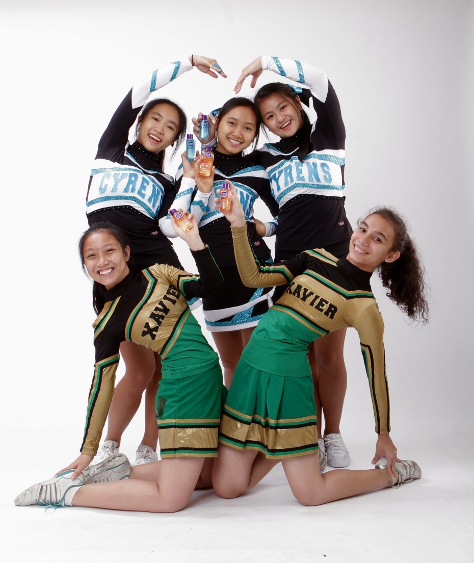 Liew (standing centre) says cheerleading helps to build confidence, and that is important for a teen who is experiencing changes in his/her skin and body. - Photos: YAP CHEE HONG/The Star