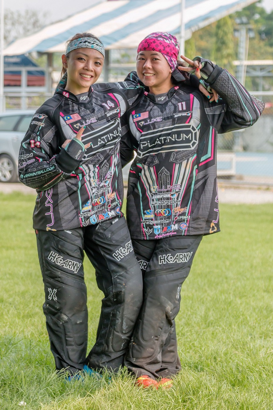Paintballer Hanna (left) poses with her teammate, Azrin Ishak who introduced her to the sport two years ago. -- 