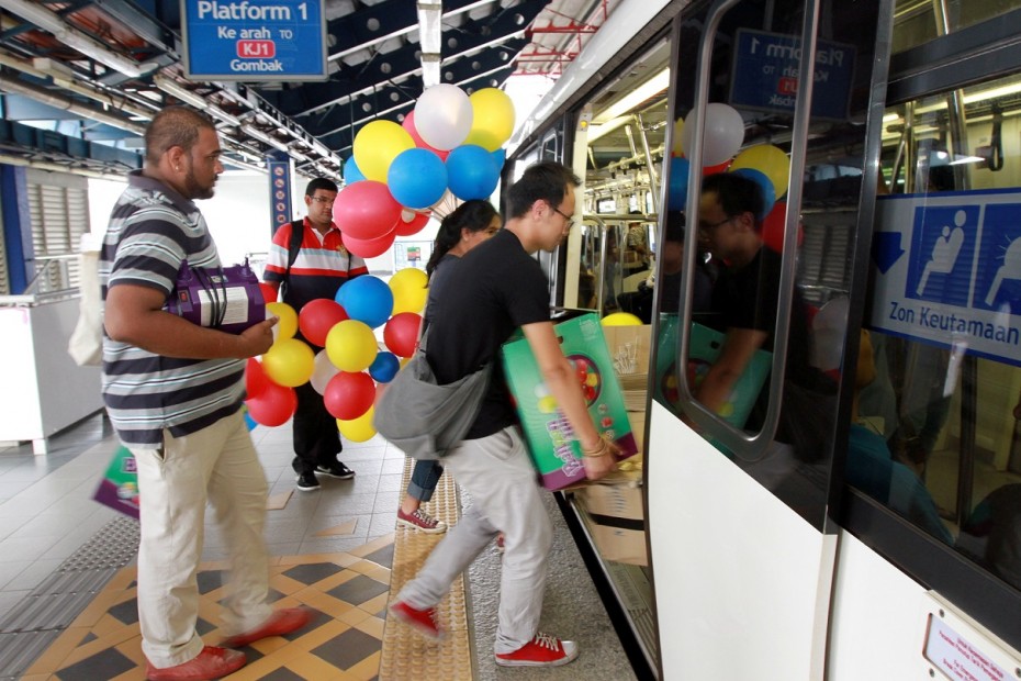 Participants load the trains with all sorts of goodies ahead of the train party. Photo: LOW LAY PHON/The Star