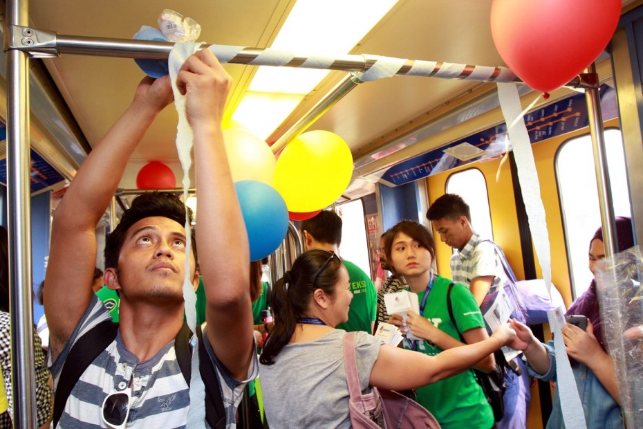 Organisers of campaign Seeding MY Hope decorate the coaches ahead of the train party. Photo: LOW LAY PHON/The Star
