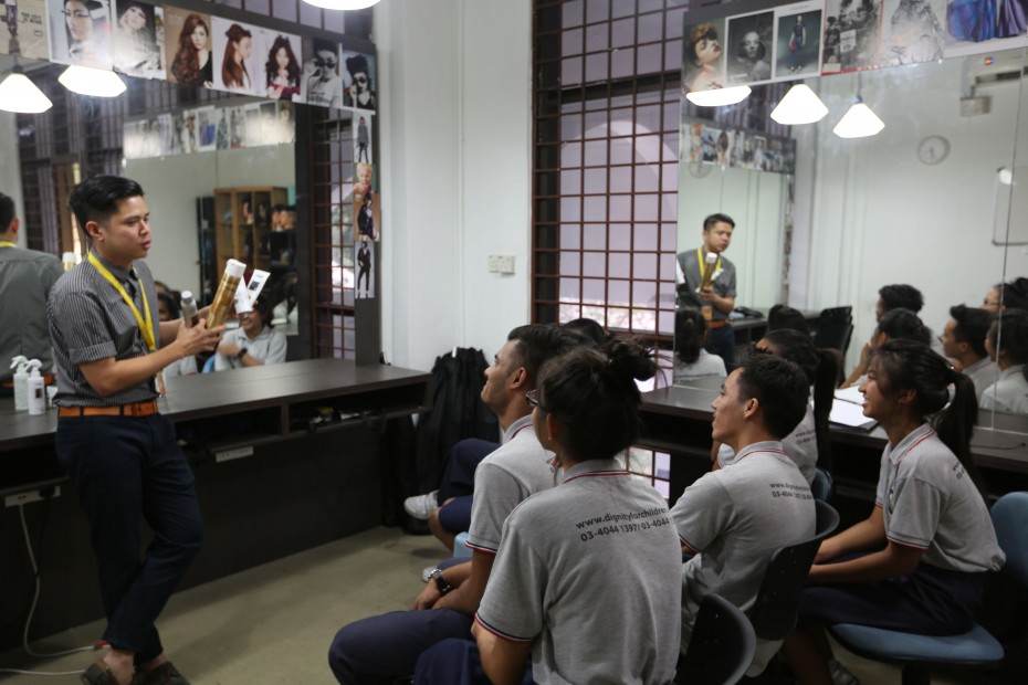 Low volunteered to design and teach a six-month hairdressing syllabus to underprivileged children, in the hopes of helping them break the cycle of poverty. ―Photo by: Lim May Lee